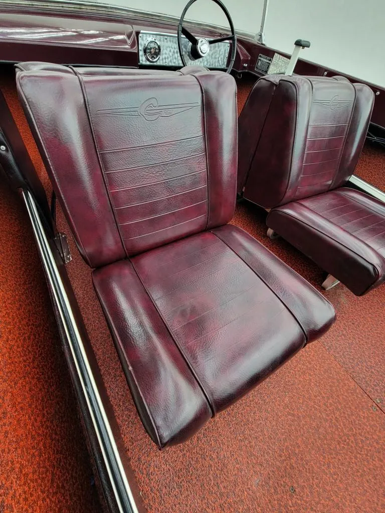 Slide: The Image of 1969 Crestliner Marauder boat interior with maroon leather seats and red carpet. - 44