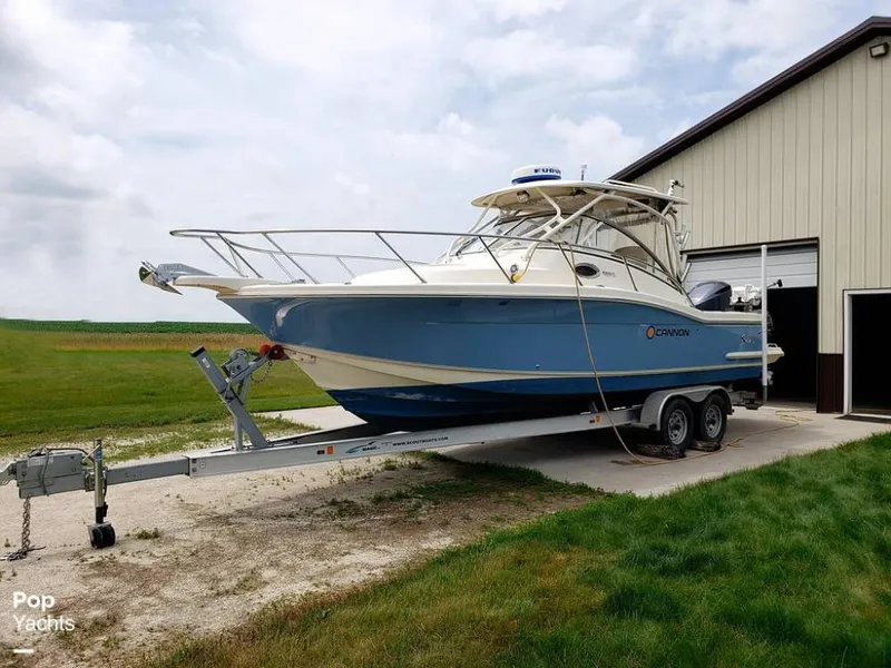 Slide: The Image of 2014 Scout 262 Abaco boat on trailer near a storage building. - 14