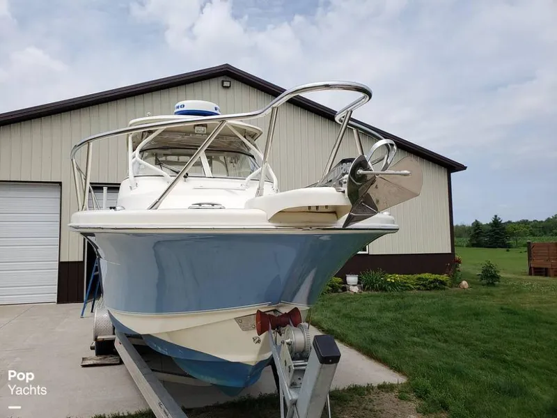 Slide: The Image of 2014 Scout 262 Abaco boat on trailer in front of a garage. - 16