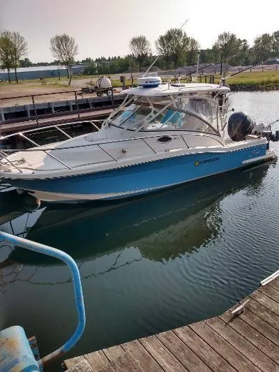 Slide: The Image of 2014 Scout 262 Abaco boat docked in a marina. - 4