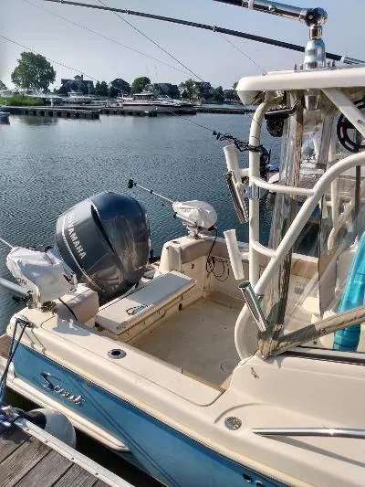 Slide: The Image of 2014 Scout 262 Abaco boat docked with Yamaha outboard motor. - 5