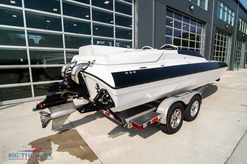 Slide: The Image of 2019 Spectre Screaming Eagle 22 Talon boat on a trailer outside a showroom. - 10