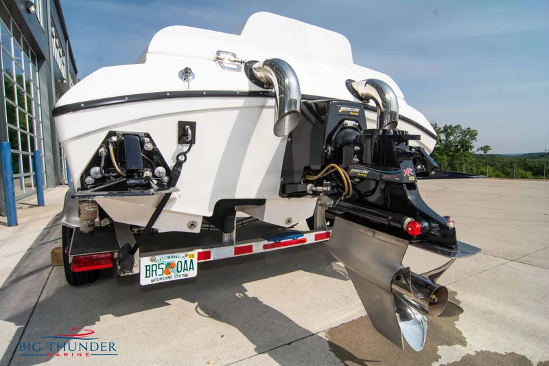 Slide: The Image of 2019 Spectre Screaming Eagle 22 Talon boat rear view with dual exhausts and outboard motor. - 13