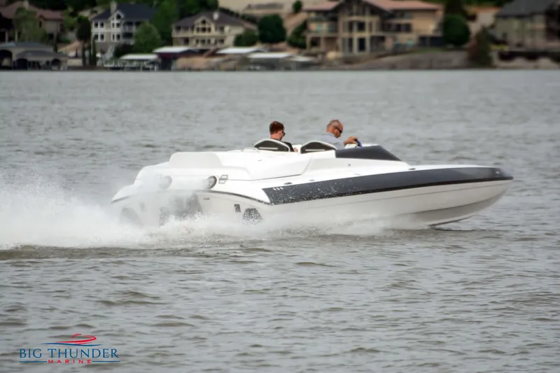 Slide: The Image of 2019 Spectre Screaming Eagle 22 Talon speedboat cruising on a lake. - 2