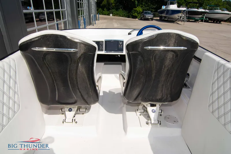 Slide: The Image of 2019 Spectre Screaming Eagle 22 Talon boat interior with carbon fiber seats. - 21