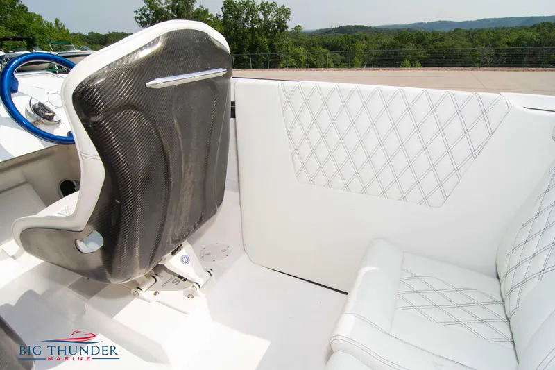 Slide: The Image of Interior of 2019 Spectre Screaming Eagle 22 Talon boat with white and carbon fiber seats. - 22