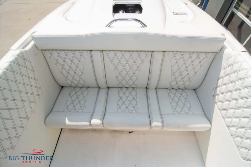 Slide: The Image of 2019 Spectre Screaming Eagle 22 Talon boat interior with white diamond-stitched seating. - 24