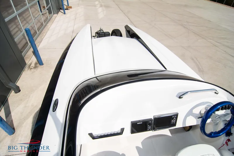 Slide: The Image of 2019 Spectre Screaming Eagle 22 Talon boat, top view, white and black design. - 35