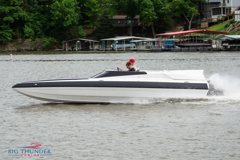 Slide: The Image of 2019 Spectre Screaming Eagle 22 Talon speedboat on a lake. - 4