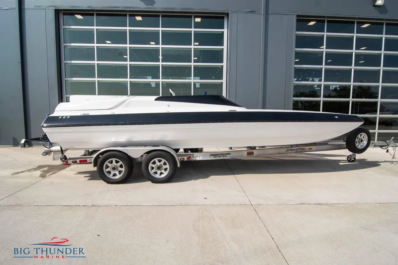 Slide: The Image of 2019 Spectre Screaming Eagle 22 Talon boat on trailer outside Big Thunder Marine. - 5