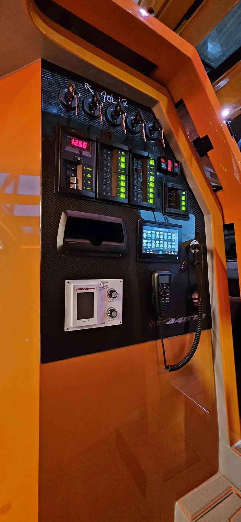 Slide: The Image of Control panel of a 2025 Statement 44 GTrs with various gauges and communication devices. - 8