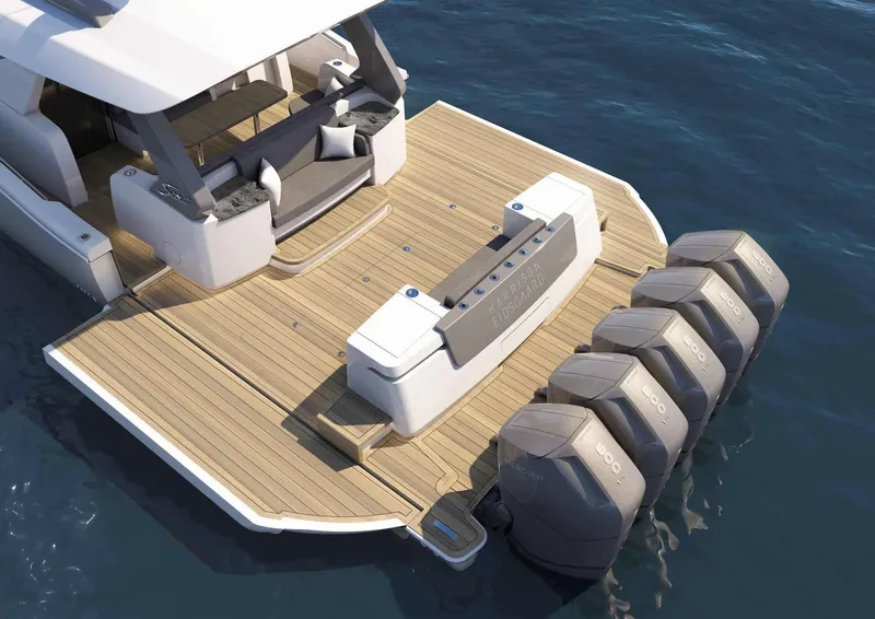 Slide: The Image of 2025 Scout 67 LX luxury yacht with quad outboard engines on the water. - 2