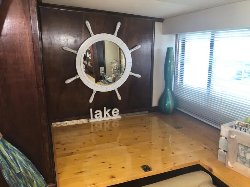 Slide: The Image of 1990 Bluewater Sedan interior with nautical decor and lake-themed accents. - 25