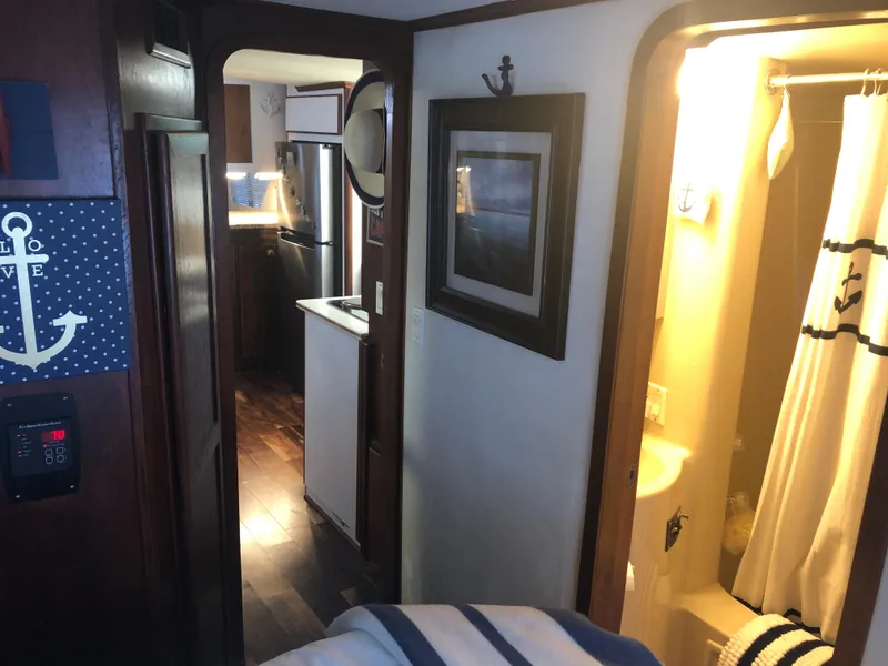 Slide: The Image of Interior of 1990 Bluewater Sedan with bathroom and kitchen view. - 34