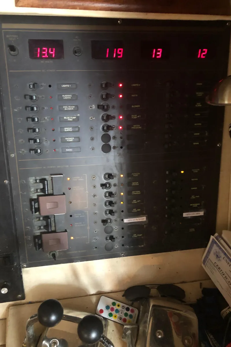 Slide: The Image of Electrical control panel in a 1990 Bluewater Sedan boat. - 49