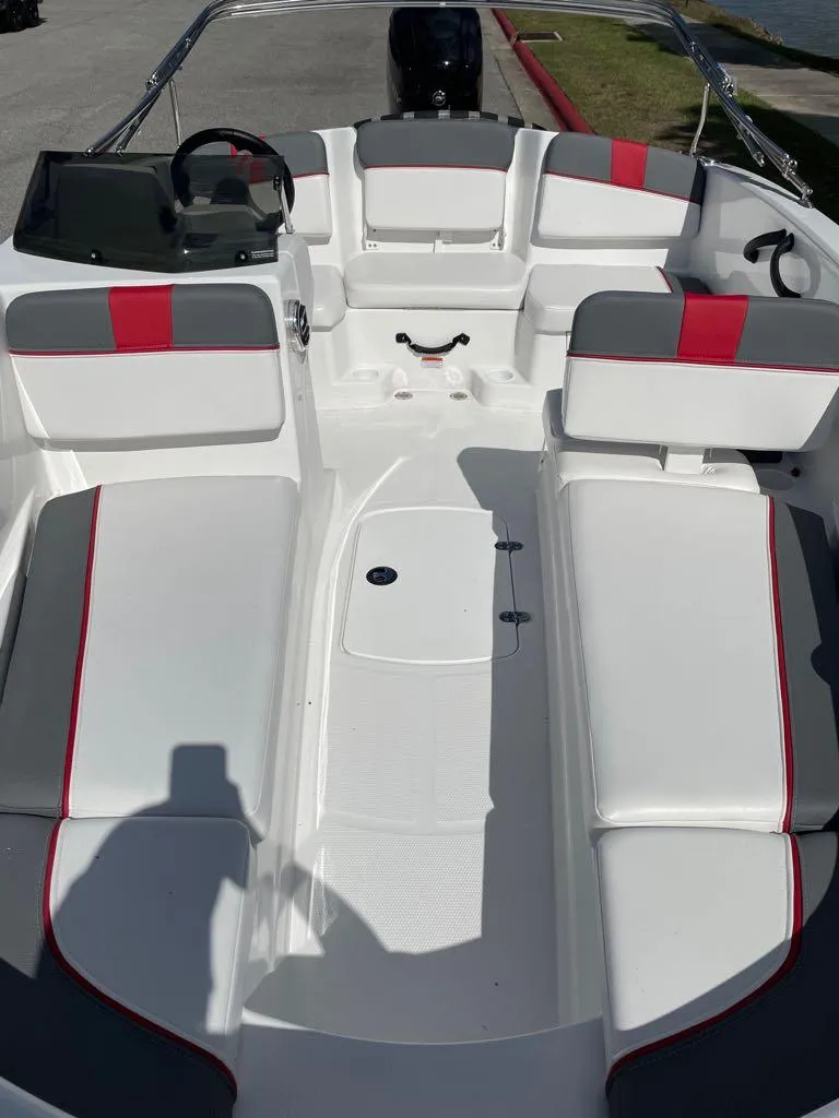 Slide: The Image of 2024 Tahoe T16 boat interior with white and red seating. - 3