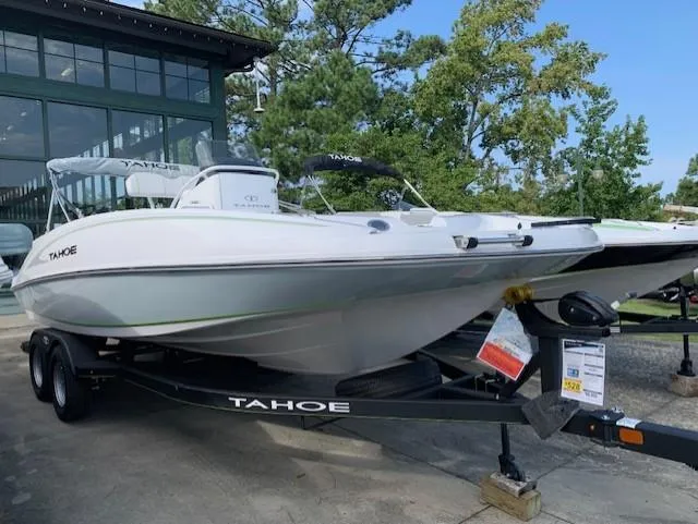 The Image of 2024 Tahoe 2150 CC boat on trailer, displayed outdoors. - 0