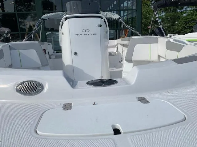 Slide: The Image of 2024 Tahoe 2150 CC boat interior with seating and storage compartments. - 1