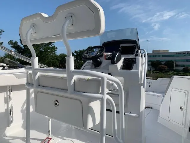 Slide: The Image of 2024 Tahoe 2150 CC boat interior with steering console and seating. - 5