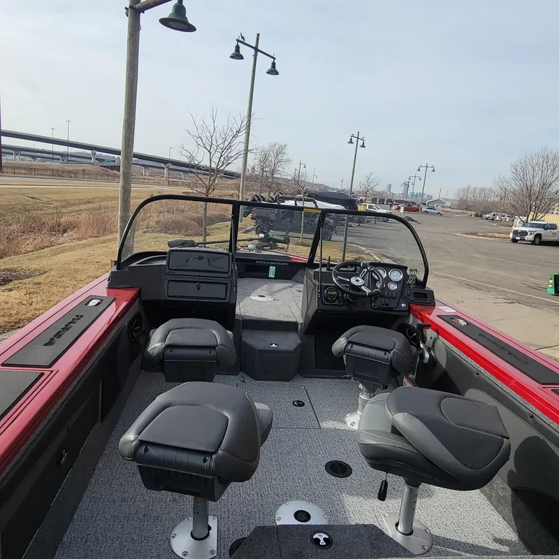 Slide: The Image of 2024 Tracker Targa V-19 WT boat interior with seating and dashboard. - 5
