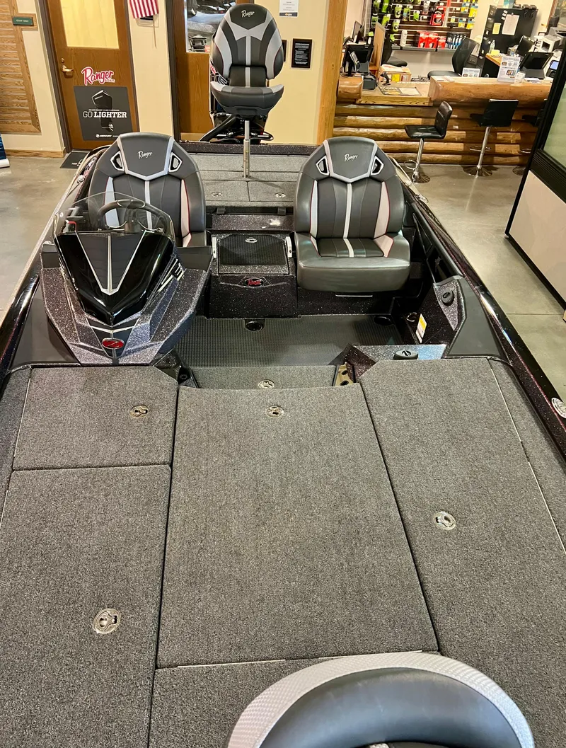 Slide: The Image of 2024 Ranger Z521R Ranger Cup Equipped fishing boat interior with seating and storage. - 5