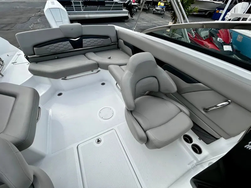 Slide: The Image of 2022 Four Winns HD5 OB boat interior with gray seating and modern design. - 12