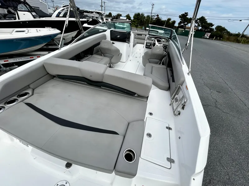 Slide: The Image of 2022 Four Winns HD5 OB boat with spacious seating and modern design. - 13