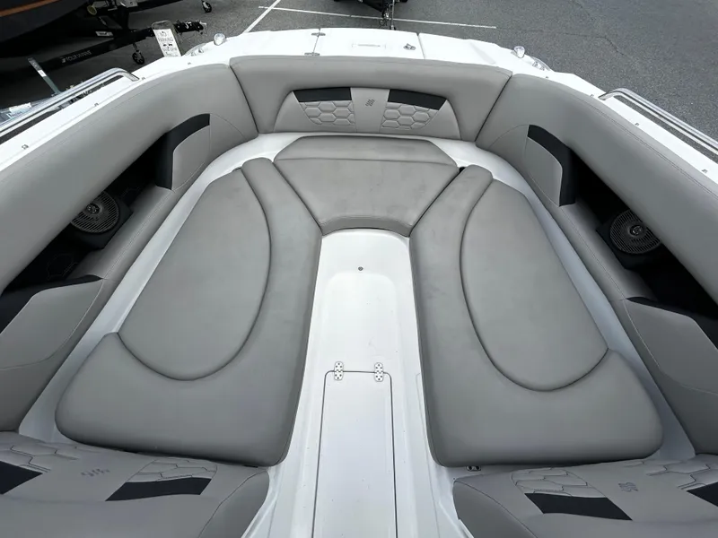Slide: The Image of 2022 Four Winns HD5 OB boat interior with gray cushioned seating. - 14