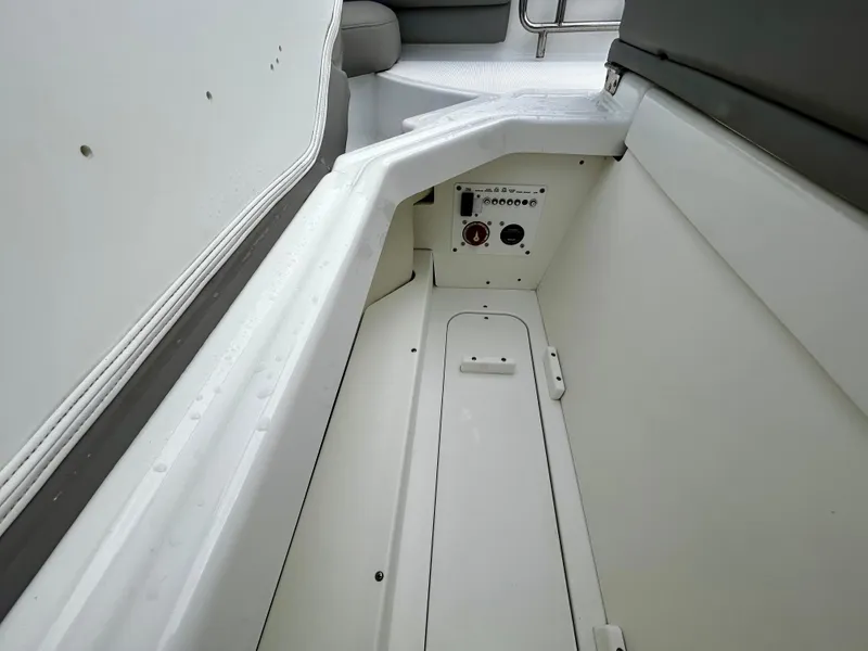 Slide: The Image of 2022 Four Winns HD5 OB boat interior storage compartment. - 16
