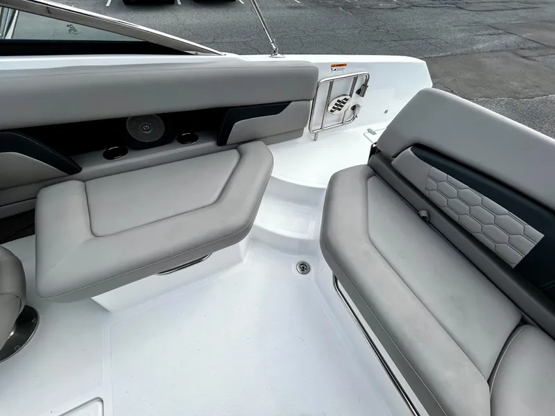 Slide: The Image of 2022 Four Winns HD5 OB boat interior with gray seating and modern design. - 17