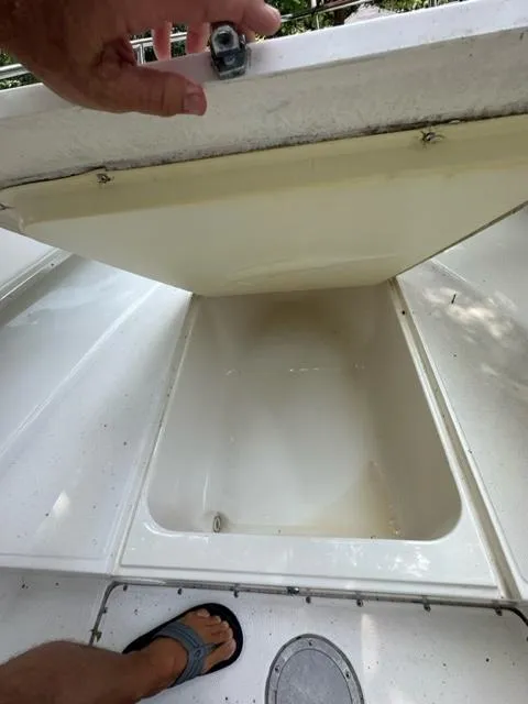 Slide: The Image of Open storage compartment on a 2002 Fountain 25 C/C boat. - 10