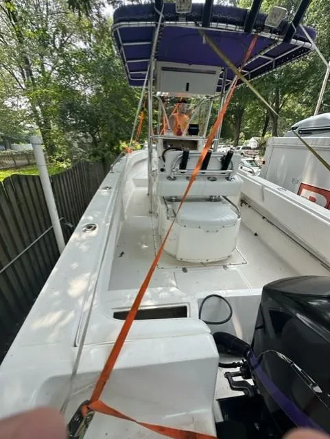 Slide: The Image of 2002 Fountain 25 C/C boat secured with safety straps. - 7