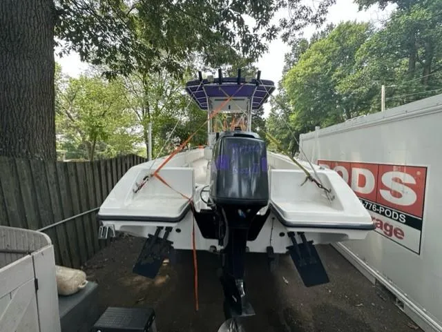 Slide: The Image of 2002 Fountain 25 C/C boat stored outdoors. - 8