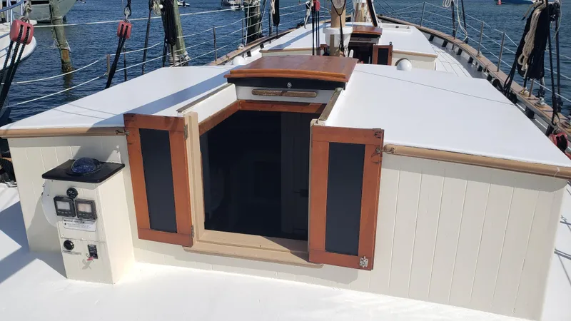 Slide: The Image of 1996 Custom Biloxi Schooner deck with open cabin doors and nautical equipment. - 16