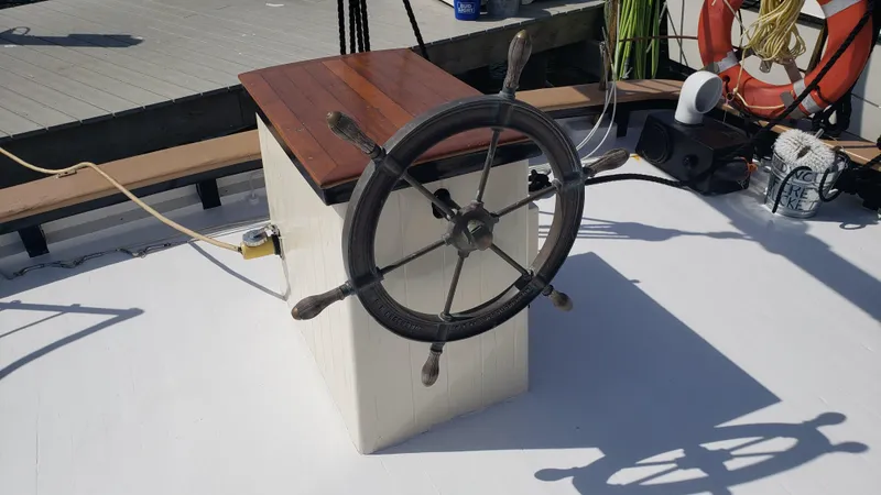 Slide: The Image of Steering wheel of a 1996 Custom Biloxi Schooner on deck. - 18
