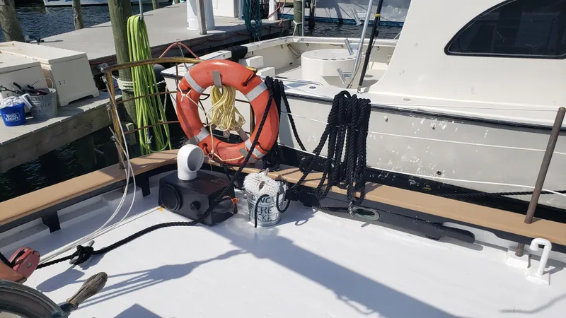 Slide: The Image of Deck of 1996 Custom Biloxi Schooner with life preserver and ropes. - 19