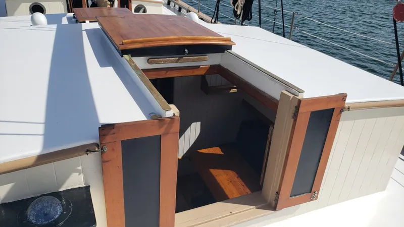 Slide: The Image of Biloxi Schooner 1996 cabin entrance with wooden doors and white deck. - 20