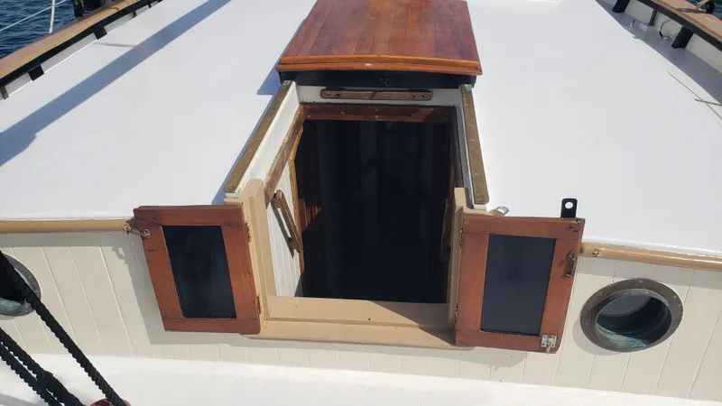 Slide: The Image of Biloxi Schooner 1996 deck with open wooden hatch and porthole. - 40