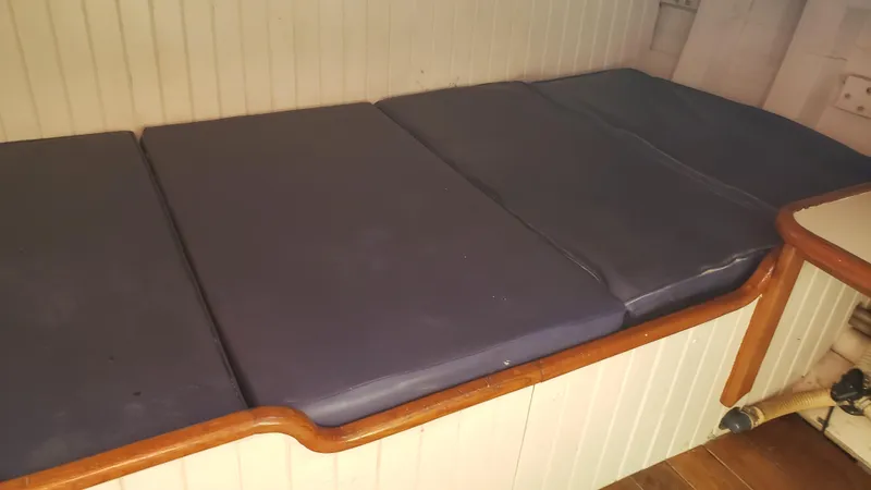 Slide: The Image of Cushioned seating area on a 1996 Custom Biloxi Schooner. - 48