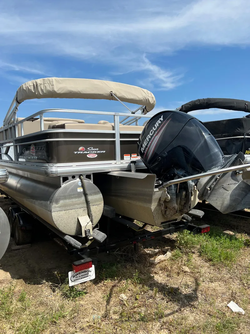 Slide: The Image of 2018 Sun Tracker SportFish 22 XP3 pontoon boat with Mercury outboard motor. - 2