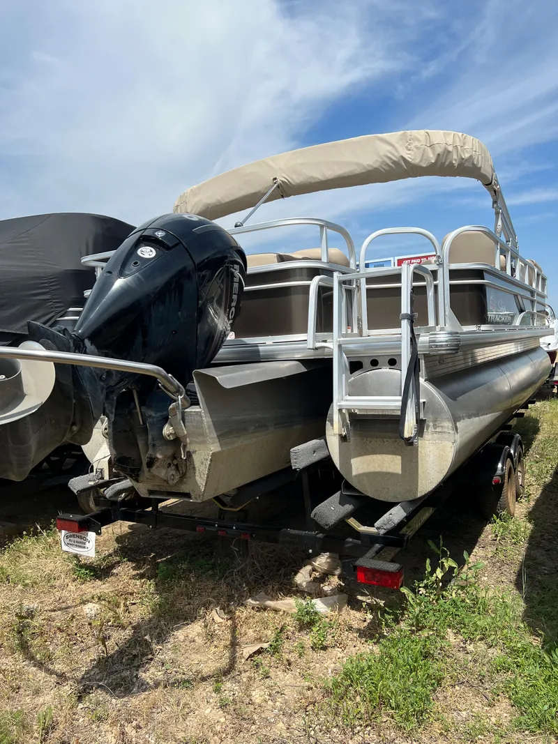 Slide: The Image of 2018 Sun Tracker SportFish 22 XP3 pontoon boat with outboard motor. - 3