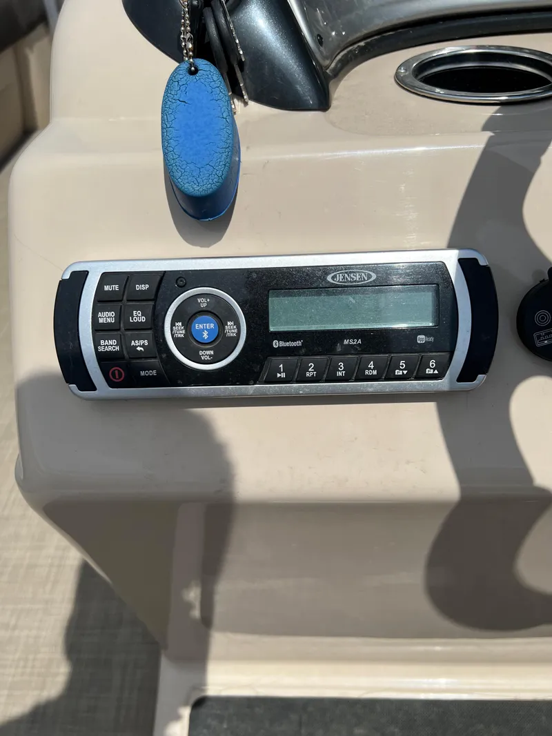 Slide: The Image of Sun Tracker SportFish 22 XP3 2018 boat dashboard with stereo system. - 9