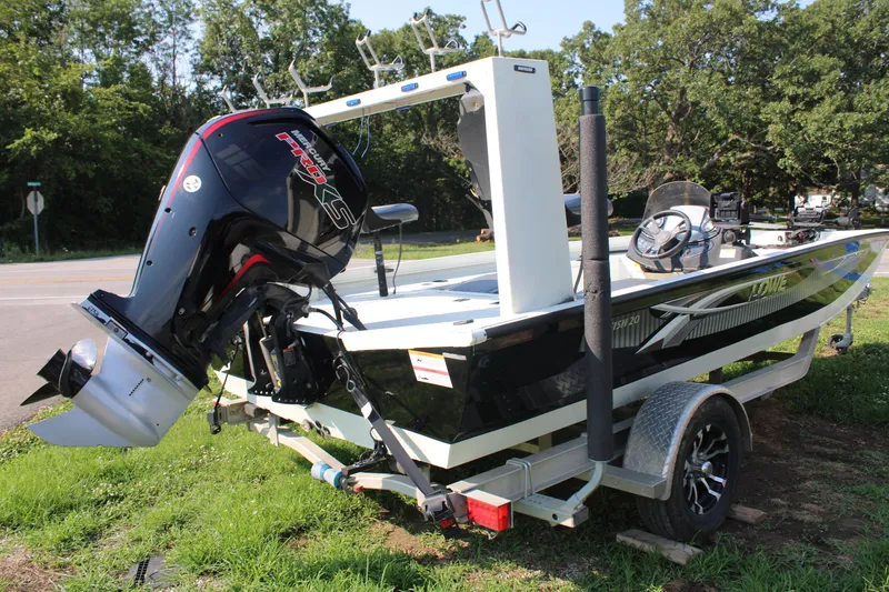 Slide: The Image of 2020 Lowe CAT 20 boat on trailer with outboard motor. - 4