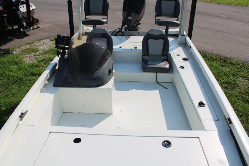 Slide: The Image of 2020 Lowe CAT 20 boat interior with seating and steering console. - 5