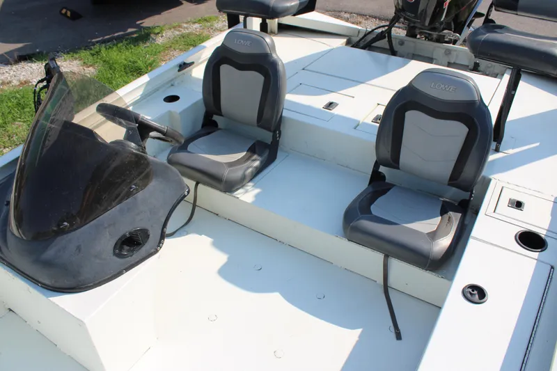 Slide: The Image of 2020 Lowe CAT 20 boat interior with dual seats and steering console. - 6