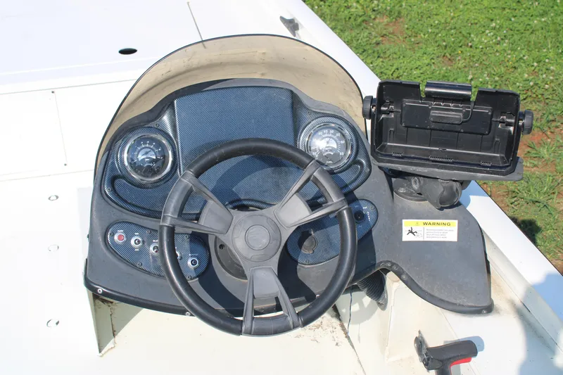 Slide: The Image of Lowe CAT 20 boat dashboard with steering wheel and control panel, 2020 model. - 7