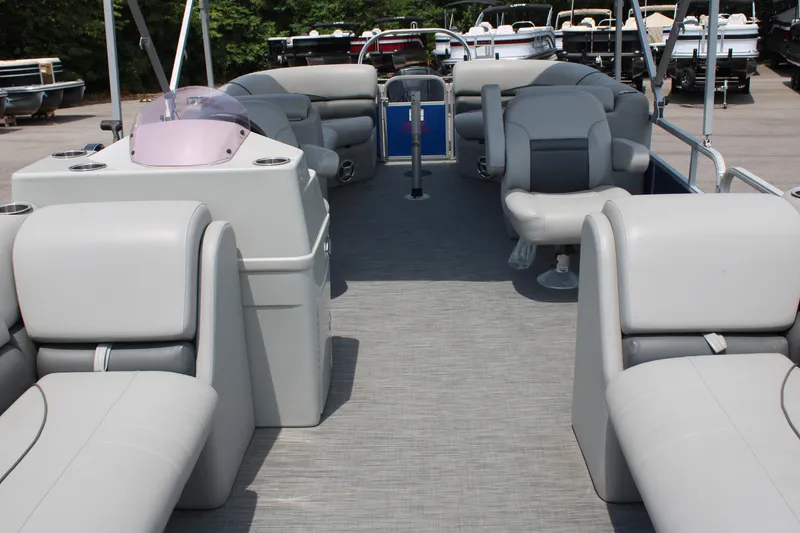 Slide: The Image of 2021 Lowe SS250 Super Sport pontoon boat interior with gray seating and helm. - 6