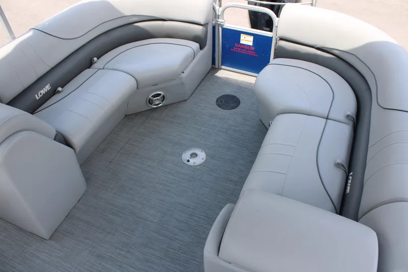 Slide: The Image of 2021 Lowe SS250 Super Sport pontoon boat interior with gray seating. - 7