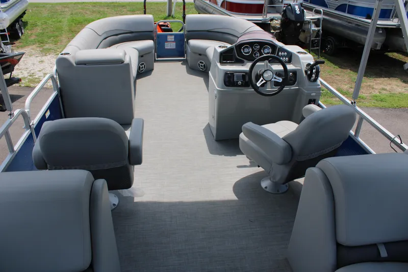 Slide: The Image of 2021 Lowe SS250 Super Sport pontoon boat interior with gray seating and helm. - 8