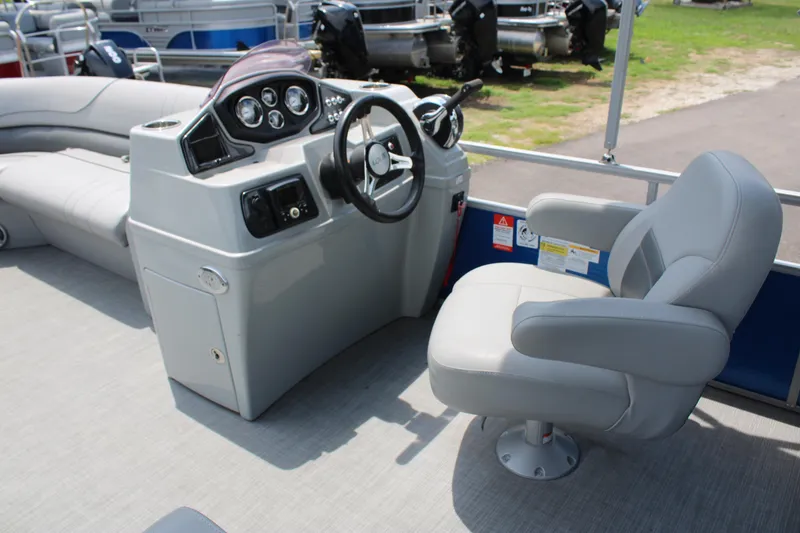 Slide: The Image of 2021 Lowe SS250 Super Sport boat interior with steering console and captain's chair. - 9